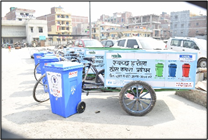 Figure 1 Door-to-door waste collection vehicle in Model Urban Village